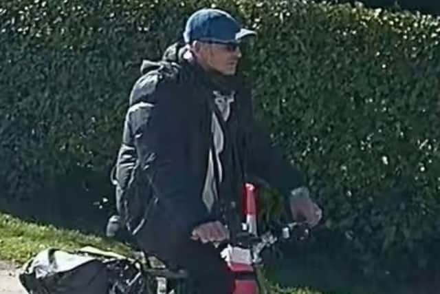 Officers want to speak to this man after a woman’s handbag was stolen in Penwortham