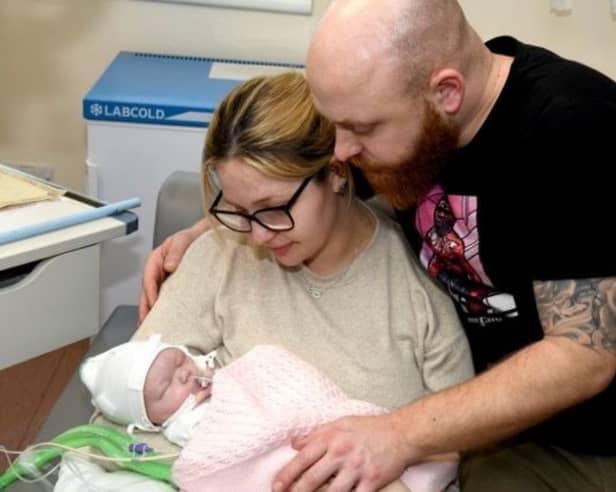 Shannon Lord, 27, and Dayle Newton, 36, with baby Ayla shortly before her tragic death. "We had to make the decision to withdraw her care as a result of severe brain damage. We sat with our girl in our arms for eleven hours watching her slowly die."