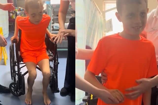 Jacob, 10, takes first steps after emergency brain surgery following road traffic accident.