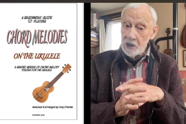 Tony now teaches the novice how to play the ukulele.