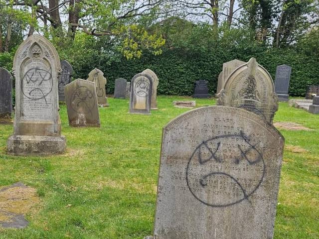 Graffiti claiming "God is a lie" was one of the many messages, alongside frowning faces. 