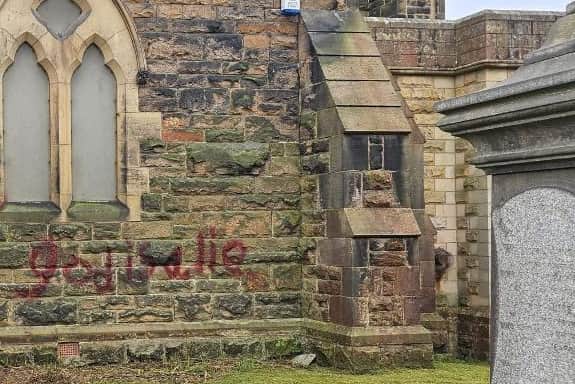 'God is a lie' was one of many hateful sayings sprayed onto the church and some graveyards. 
