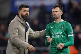 Miron Muslic, manager of Plymouth, with Ryan Hardie