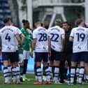 Preston North End manager Paul Heckingbottom talks to his team during a break in play