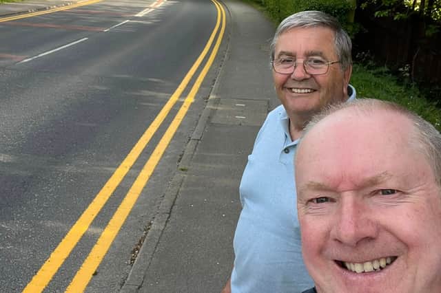 The new double yellow lines in Brindle Road. Pictured are County Councillors Barrie Yates and Jeff Couperthwaite