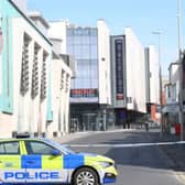 A suspect has been charged after a man attacked two police officers before climbing onto a roof in Blackpool