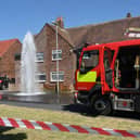Eruption of water on Rodwell Walk.