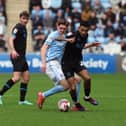 Preston North End's Kaine Kesler Hayden battles with Coventry City's Jack Rudoni