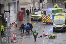 Police and emergency personnel dealing with a road traffic accident on Water Street near the Liver Building in Liverpool after a car collided with pedestrians during the Premier League winners parade
