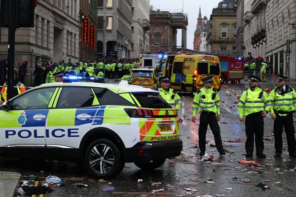 Police officers stand on duty at a cordon at the entrance to Water Street on May 26.
