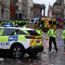 Police officers stand on duty at a cordon at the entrance to Water Street on May 26.