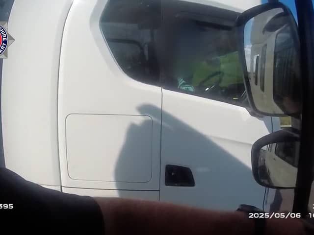 Lorry driver caught rolling cigarette with no hands on wheel