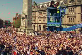 Preston North End PNE promotion champions championship celebrate team flag market parade procession Photographer Lindsey North high above the crowd 
