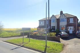The land is behind houses off Crosshall Brow