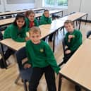 Pictured from left to right on the back row are at Lea Community Primary School after the £3.5m expansion which will double pupil intake are: pupils Alara, Etta and Samaira, and on the front row, from left to right are Vinny and Samuel