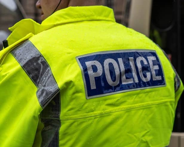 A robbery in Blackpool ended with both the victim and a police officer being bitten by a dog