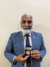 Dr Sakthi Karunanithi with his medal