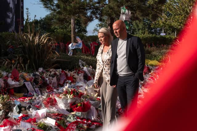 Liverpool boss Arne Slot and his wife visit the tributes that have been laid outside Anfield since the tragic car accident that claimed the life of Reds favourite Diogo Jota and his brother Andre Silva