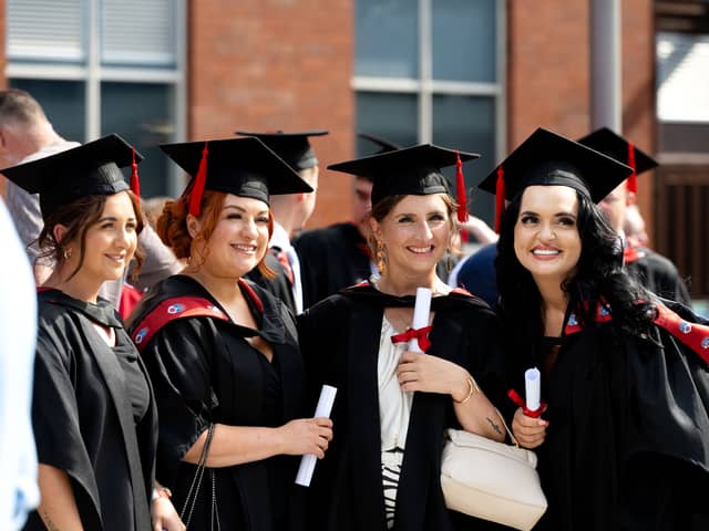 A group of graduates posing for a photo