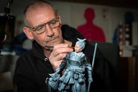 Founder of War Office Figures Gary MacMillan painting a figure.