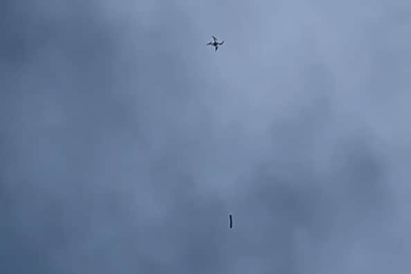 One video shared on Facebook shows a large package hanging from a drone as it makes its way towards the grounds of HM Prisons Wymott and Garth in Ulnes Walton, near Leyland