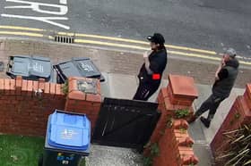 Officers want to speak to these two men after a postman was overpowered and robbed of a parcel in Blackpool
