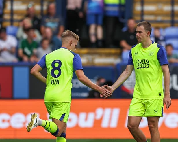 Preston North End's Mads Frokjaer shake hands with Ali McCann 