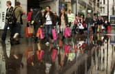 People walk past a Topshop and Topman store on Oxford Street in October 2006 (Photo: Scott Barbour/Getty Images)
