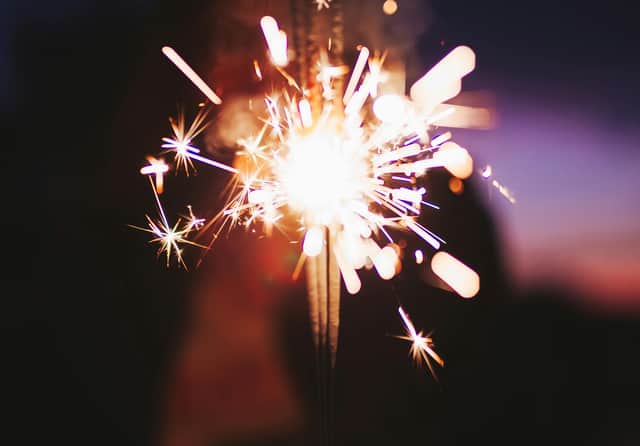 A woman in her 20s was taken to hospital after being struck by a firework that was thrown at a bus she was travelling on.
