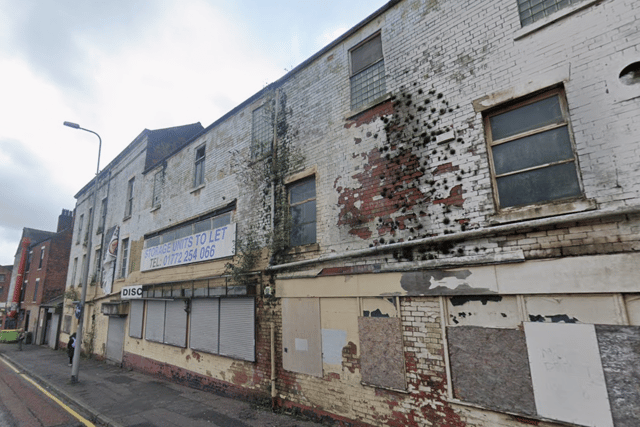 The empty shops on Church Row - which the apartments would replace - have been vacant for almost two decades