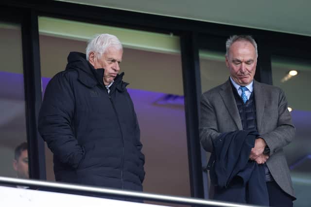 Preston North End director Peter Ridsdale looks on with Ian Penrose by his side