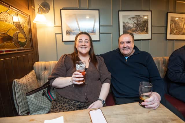 Punters enjoying one of their first pints back.