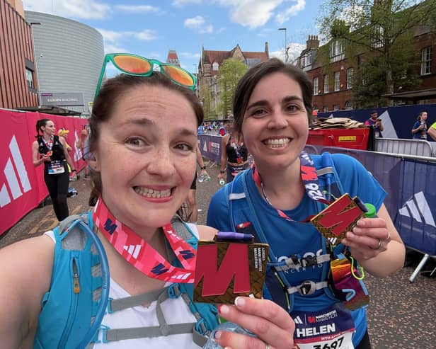 Kat (left) and Helen celebrate completing the Manchester Marathon