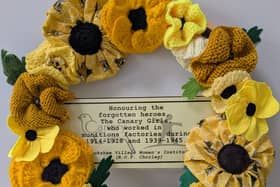 A wreath of yellow poppies, symbolising remembrance of the “Canary Girls” and other women who served on the home front, laid ahead of the Buckshaw Village memorial unveiling