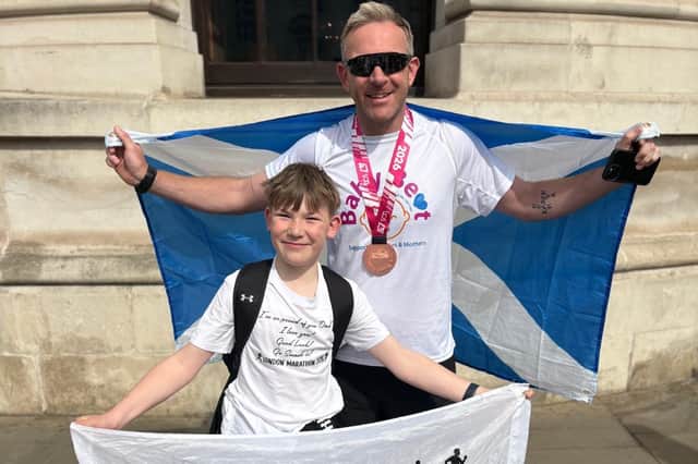 'I ran this for Eva'  The reason Chorley dad-of- two and army major Neil Williams ran 'tough' London marathon. Pictured with son Noah 