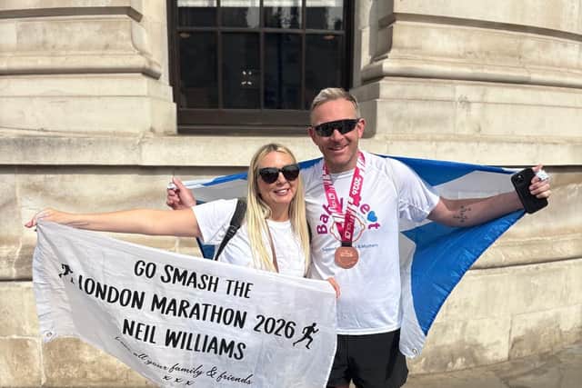 Neil is congratulated on his London Marathon finish by son Noah and by sister Emily Kreyling