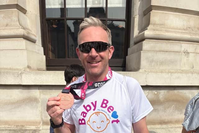 Neil Williams with his finishers’ medal