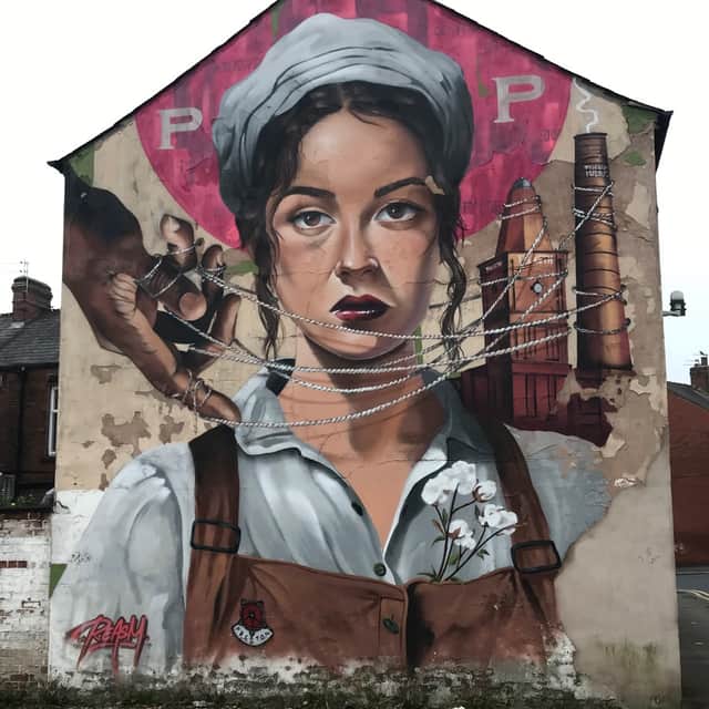 The mill lass Betsy Leigh mural on Blanche Street created by Preston artist Shaun Sharpe