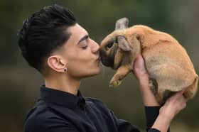 Bailey Lister with Daisy the rabbit at Hugo's Small Animal Sanctuary.