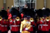 King Charles III takes a salute after returning to Buckingham Palace, London, following the State Opening of Parliament in the House of Lords at the Palace of Westminster. 13/05/26