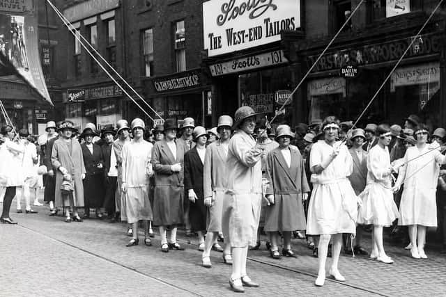 Whit Walkers on Church Street in Preston during the 1920s. A century ago, Whitsuntide brought thousands into the town centre for processions, music, banners and fairground fun