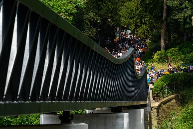 People were poised to flock over the new bridge as soon as the ribbon was cut