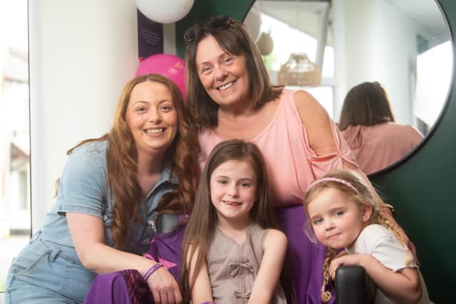 Rosa, before her haircut, with hairdresser Lauren Eccles, nana Bernie Killeen and sister Thea Whiston, 4.