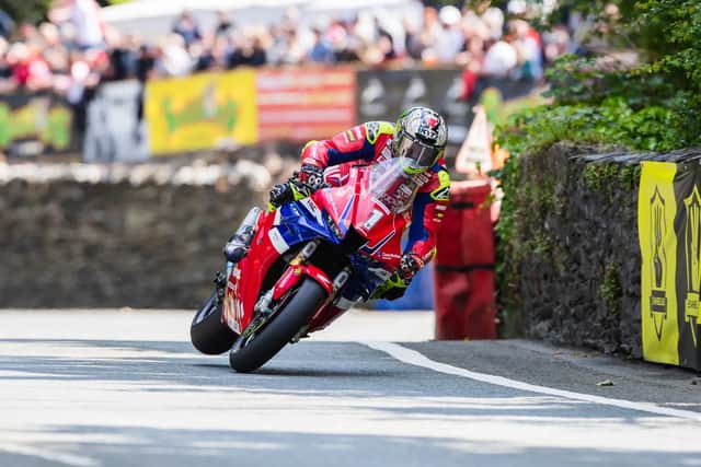 John McGuinness races around the Isle of Man in practice