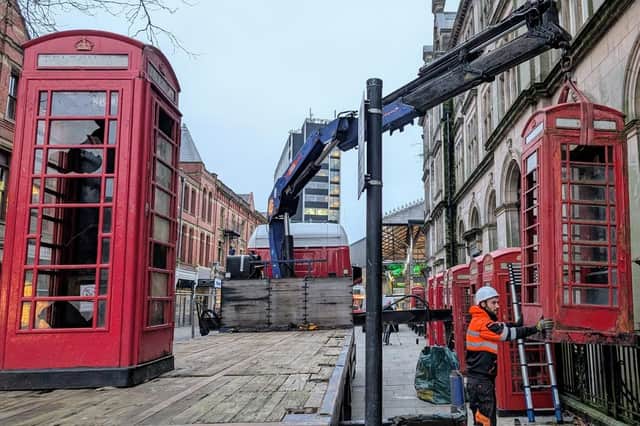 The row of red phone boxes on Market Street was worse for wear when it was temporarily removed in December 2024