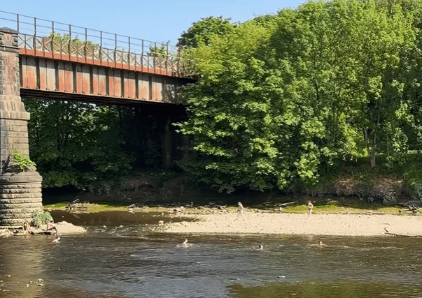 Youngsters swimming in the River Ribble after a number of young people died in UK waters during the recent heatwave
