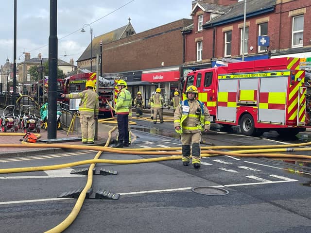 Firefighters responding to a major fire at the former Ex Catalogue store and M&S in Lord Street, Fleetwood. Huge flames and thick black smoke can be seen billowing across the town