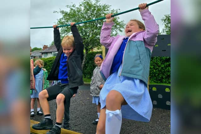 Year 5 Pupil, Ruby Clarke (R), whose speech to the Parish Council was so compelling, enjoying the fruits
of her labour.