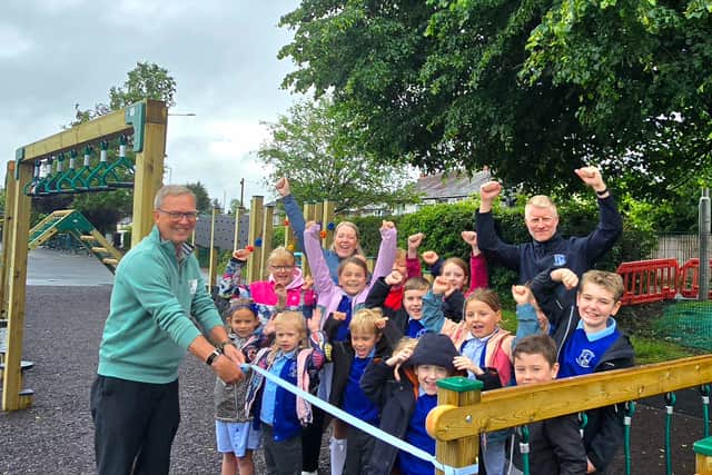 Peter Burton (L), Chair of Grimsargh Parish Council, pictured with teachers and pupils of Grimsargh St. Michael’s
