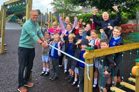 Peter Burton (L), Chair of Grimsargh Parish Council, pictured with teachers and pupils of Grimsargh St. Michael’s